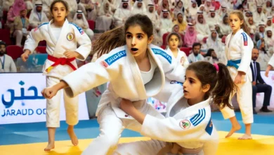 Dall·e 2024 08 25 16.25.43 An Image Capturing The Excitement And Enthusiasm Of Young Female Judo Athletes Participating In The Arab Judo Championship In Alamein. The Image Shoul