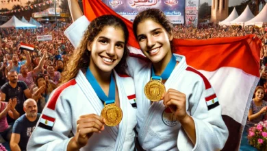 Dall·e 2024 08 25 17.00.56 A Dynamic Scene At Alamein Festival Featuring The Egyptian Twin Sisters Farida And Fayrouz Celebrating Their Gold Medal Victory In The Arab Judo Champ