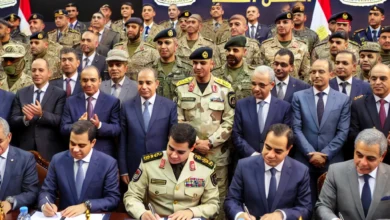 Dall·e 2024 09 01 11.52.41 A Formal Signing Ceremony Between Representatives Of The Egyptian Ministry Of Education And The Popular And Military Defense Forces. The Scene Feature