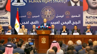 Dall·e 2024 09 15 22.09.00 A Formal Political Setting Showing A Government Official Or Parliament Member Like Ayman Mohseb Speaking At A Podium During A Press Conference About